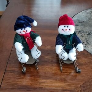 Festive Snowman Figurines with Sleds